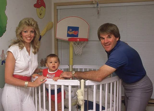 Carol J. Woliung and Pete Rose with their kid